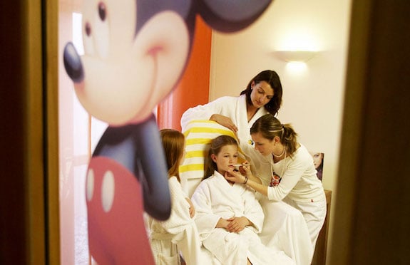 Little girl having make-up applied, Hotel Die Post