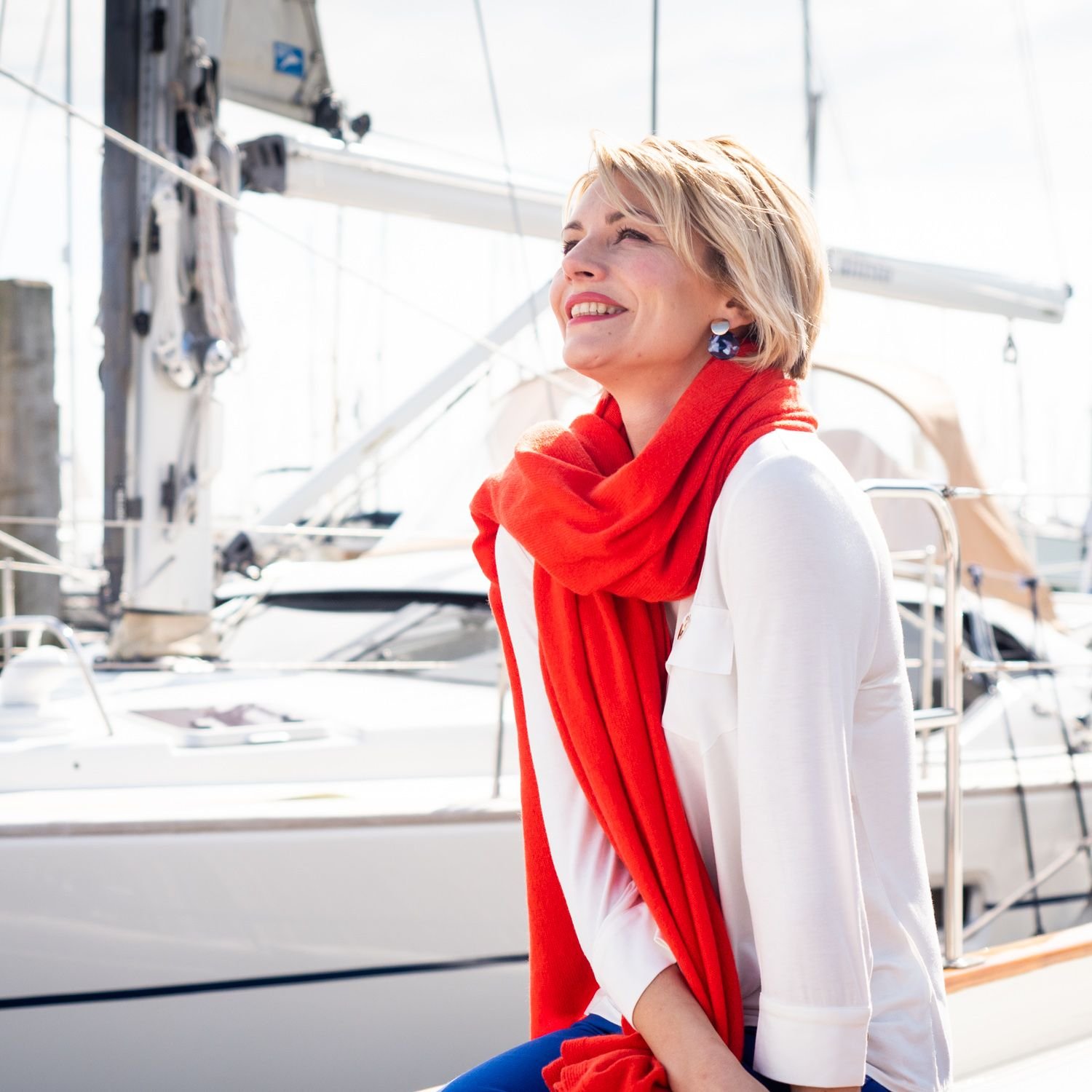 woman on boat with orange cashmere wrap shawl