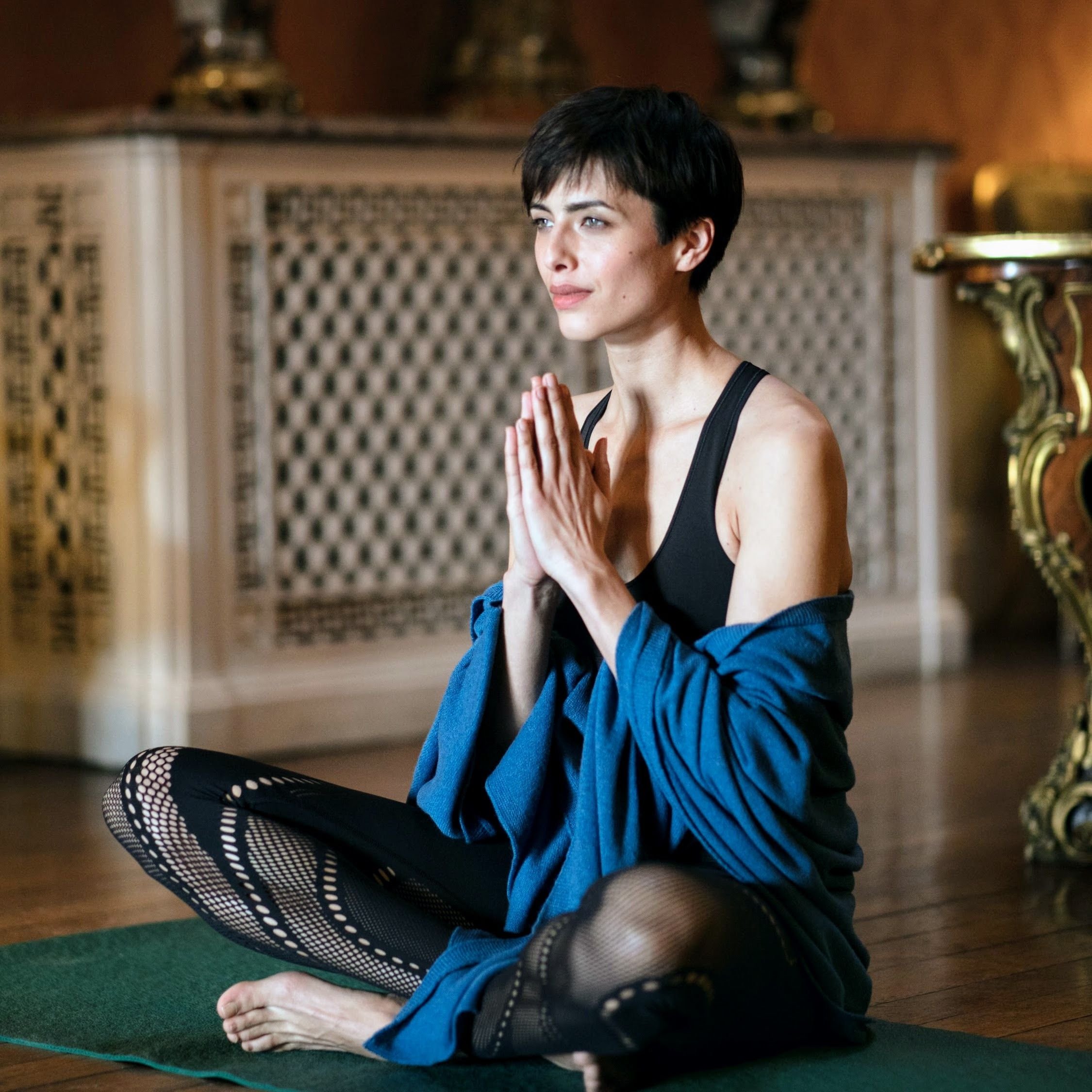 woman doing yoga with teal blue cashmere shawl wrap 